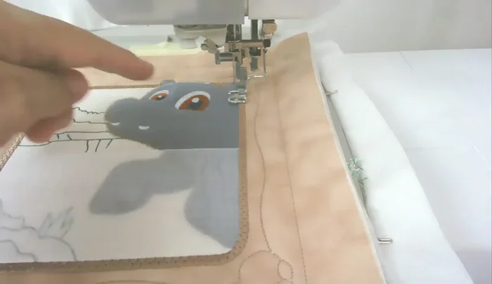 Satin stitch around the head (number sixteen).