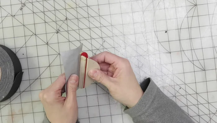 Add finger loops to the back of the head (if forgotten initially).