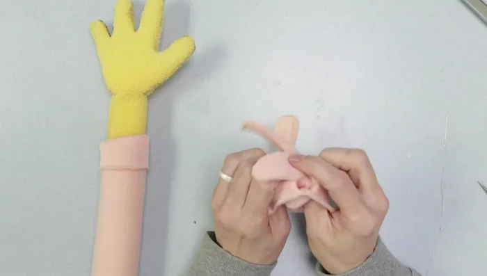 Create hands using same method as arms, cover with nylon fleece glove.